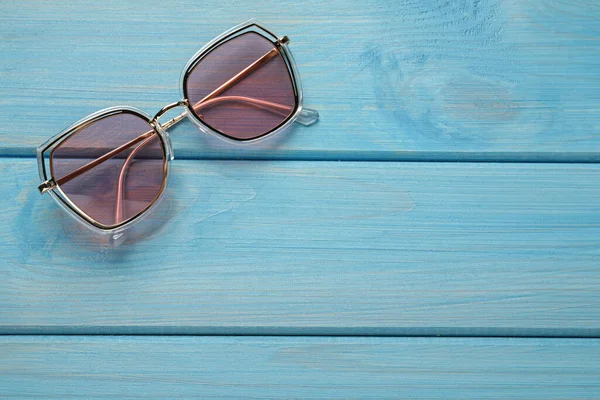New Stylish Sunglasses Turquoise Wooden Table Top View Space Text — 图库照片
