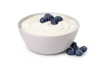 Bowl of delicious yogurt with blueberries on white background