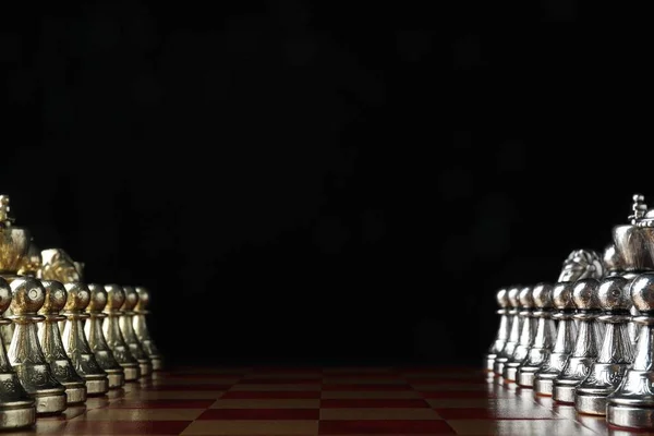 Chessboard with game pieces on black background. Space for text