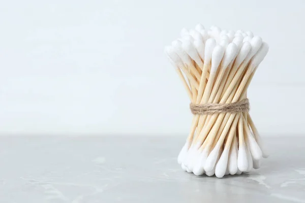 Many Cotton Buds Light Grey Marble Table Space Text — Foto de Stock