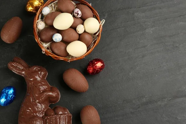 Flat Lay Composition Chocolate Easter Bunny Eggs Black Table Space — Foto Stock