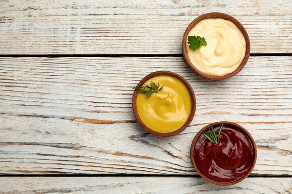 Bowls Mustard Ketchup Mayonnaise Wooden Table Flat Lay Space Text — Stock Fotó