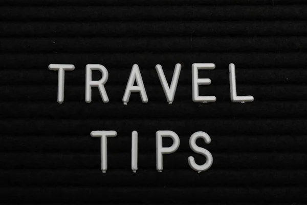 Phrase Travel Tips Black Letter Board Background Top View — Stockfoto