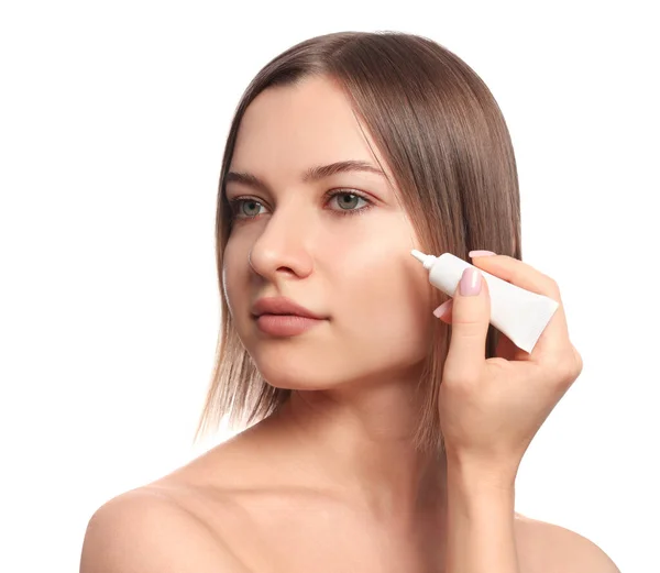 Young Woman Applying Cream Eyes White Background — Stok fotoğraf