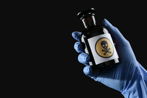 Woman Gloves Holding Glass Bottle Poison Warning Sign Black Background — Stock Photo, Image