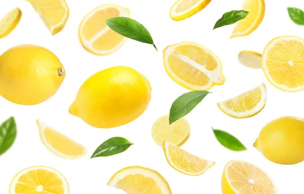 Fresh Ripe Lemons Green Leaves Falling White Background — Fotografia de Stock