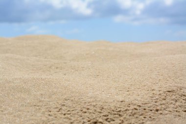 Beautiful sand in desert under cloudy sky, closeup