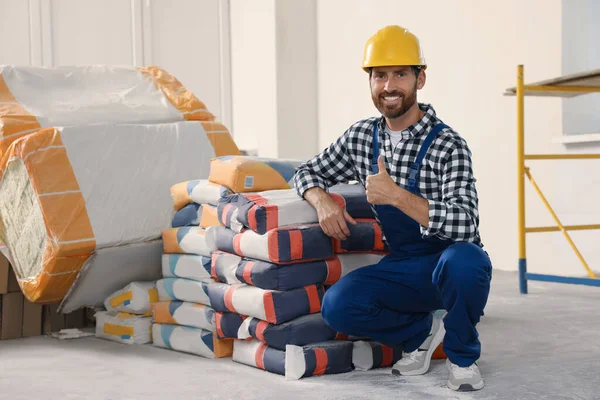 Professional Builder Uniform Cement Bags Indoors — Stockfoto