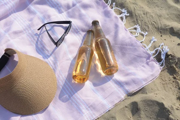 Pink Blanket Stylish Visor Cap Sunglasses Bottles Beer Sandy Beach — Stockfoto