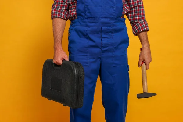 Professional Builder Uniform Hammer Toolbox Yellow Background — Zdjęcie stockowe