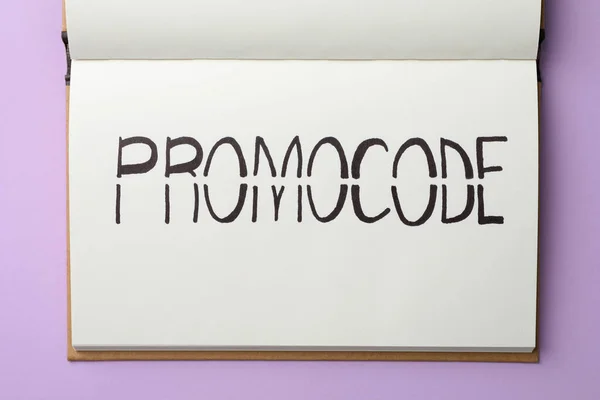Notebook Words Promo Code Violet Background Top View — Stock Fotó