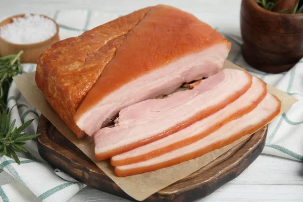 Delicious Smoked Bacon White Wooden Table Closeup — Stock Fotó