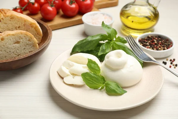 Delicious Burrata Cheese Basil Served White Wooden Table — Zdjęcie stockowe