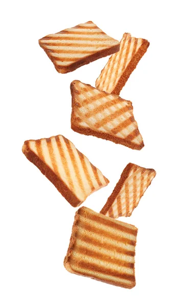 Slices Tasty Toasted Bread Falling White Background — Stockfoto
