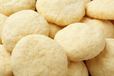Tasty sugar cookies as background, closeup view