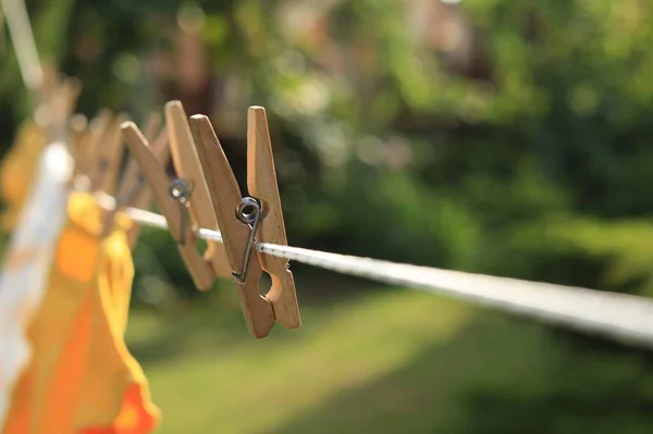 Clean Clothes Drying Outdoors Sunny Day Focus Laundry Line Wooden — Foto de Stock