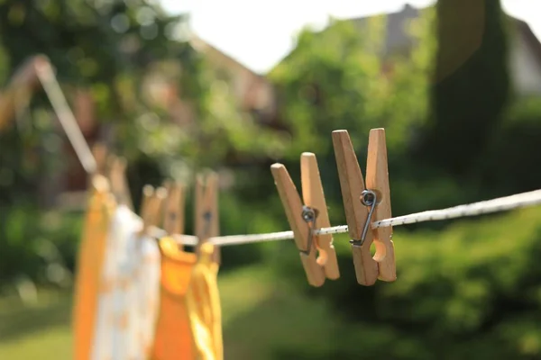 Clean Clothes Drying Outdoors Sunny Day Focus Laundry Line Wooden — Stockfoto