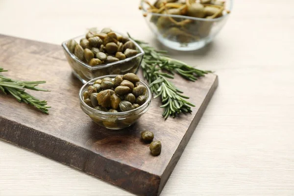 Delicious Pickled Capers Rosemary Twigs White Wooden Table Space Text — ストック写真