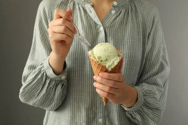 Woman Eating Green Ice Cream Wafer Cone Grey Background Closeup — Fotografia de Stock