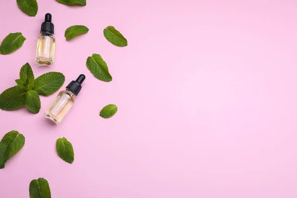 Bottles Essential Oil Mint Pink Background Flat Lay Space Text — Stockfoto