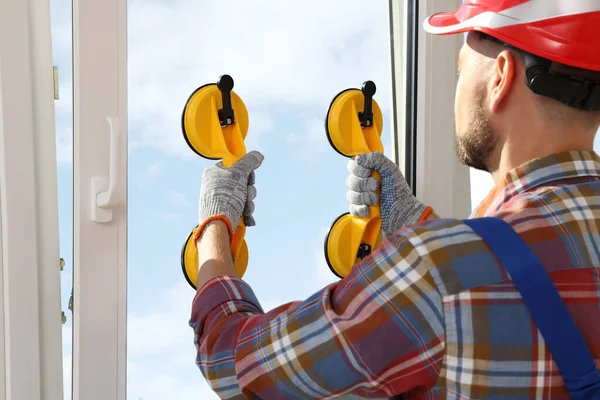 Worker Using Suction Lifters Plastic Window Installation Indoors — Foto de Stock