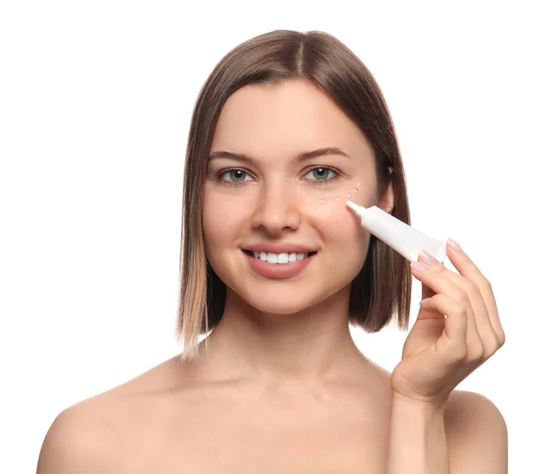 Young Woman Applying Cream Eyes White Background — Stockfoto