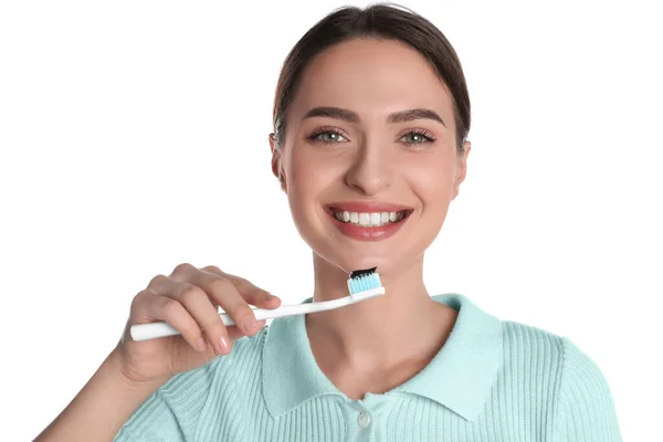 Young Woman Holding Brush Charcoal Toothpaste White Background — Stok Foto