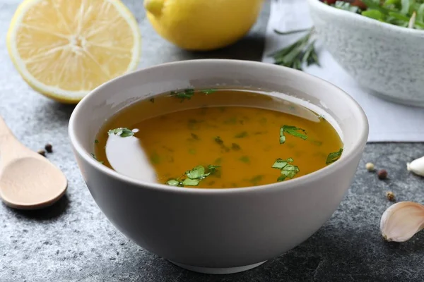 Bowl Lemon Sauce Grey Table Closeup Delicious Salad Dressing — Fotografia de Stock