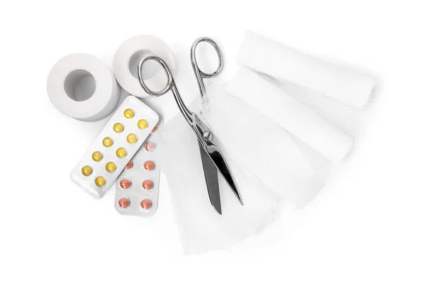 Medical Bandage Rolls Pills Sticking Plaster Scissors White Background Top — Fotografia de Stock