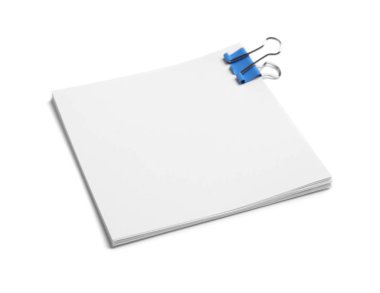 Note paper sheets with blue clip isolated white