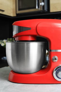 Modern stand mixer on table in kitchen, closeup
