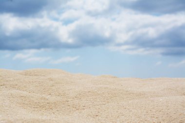 Beautiful view of sand in desert under cloudy sky
