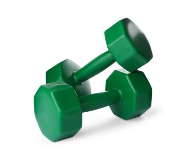 Green dumbbells on white background. Weight training equipment