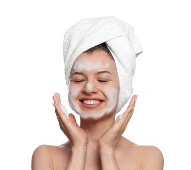 Young woman washing face with cleansing foam on white background. Skin care cosmetic
