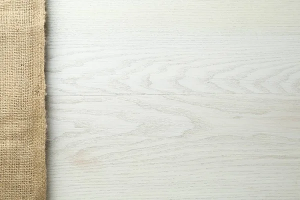 Naturalny Materiał Jutowy Białym Drewnianym Stole Widok Góry Miejsce Tekst — Zdjęcie stockowe