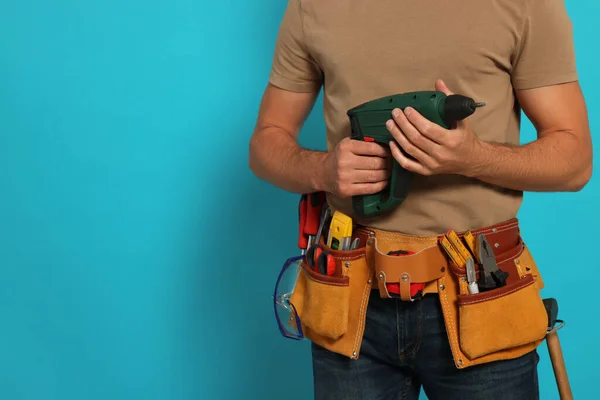 Professional Builder Tool Belt Power Drill Light Blue Background Closeup — Stockfoto