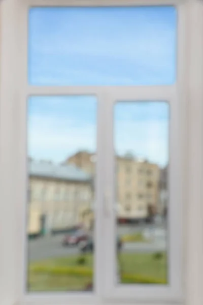 Blurred view of window with white frame indoors