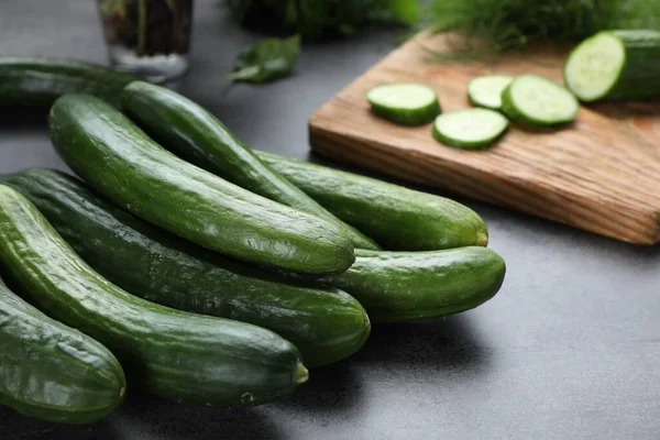 Fresh Ripe Cucumbers Grey Table Closeup — Stockfoto