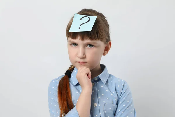 Pensive Girl Question Mark Sticker Forehead White Background — ストック写真