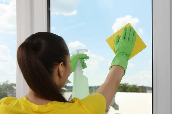 Woman Cleaning Window Glass Sponge Cloth Spray Indoors — Stockfoto