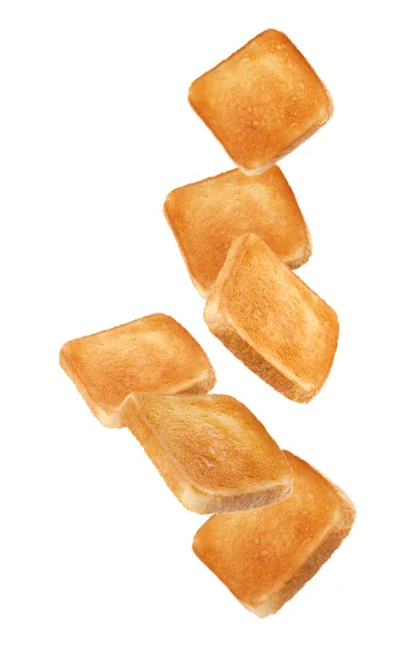 Кусочки Вкусного Жареного Хлеба Падают Белом Фоне — стоковое фото