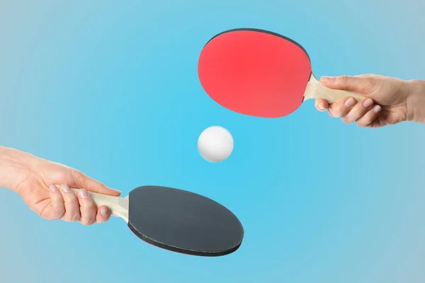 Women Ping Pong Paddles Ball Light Blue Background Closeup — ストック写真