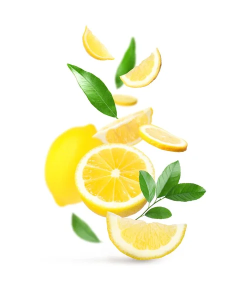 Fresh Ripe Lemons Green Leaves Falling White Background — Stok fotoğraf