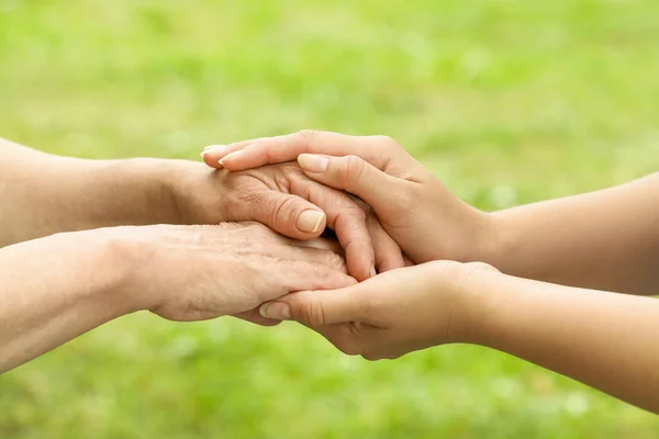 Young Elderly Women Holding Hands Outdoors Closeup — Stock Photo, Image