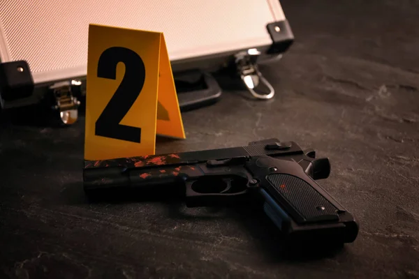 Gun Blood Evidence Marker Black Slate Table Closeup Crime Scene —  Fotos de Stock
