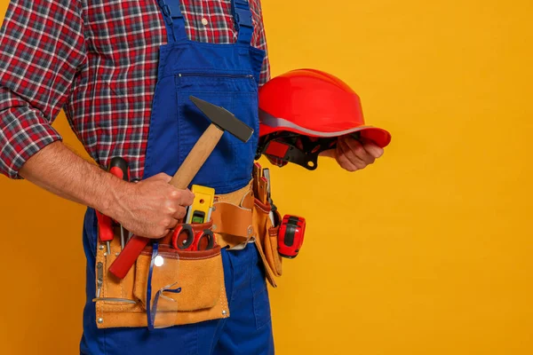 Professional Builder Uniform Hammer Tool Belt Yellow Background Closeup — Stockfoto