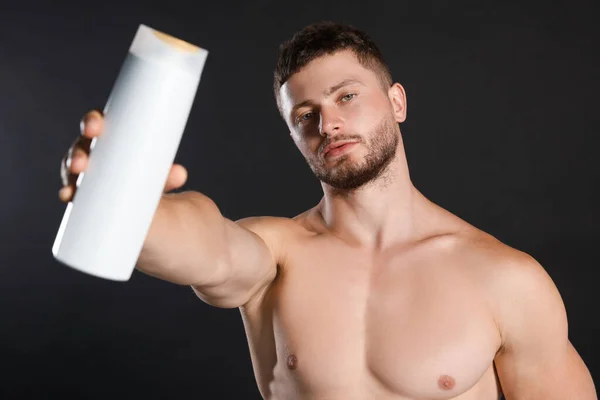 Shirtless Young Man Holding Bottle Shampoo Black Background — 스톡 사진