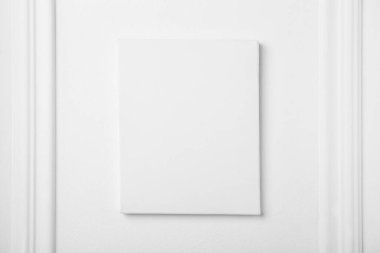 Blank canvas on white wall. Space for design