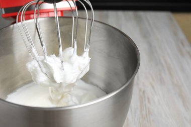 Modern stand mixer on wooden table indoors, closeup. Space for text