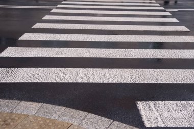 Pedestrian crossing in city outdoors after rain
